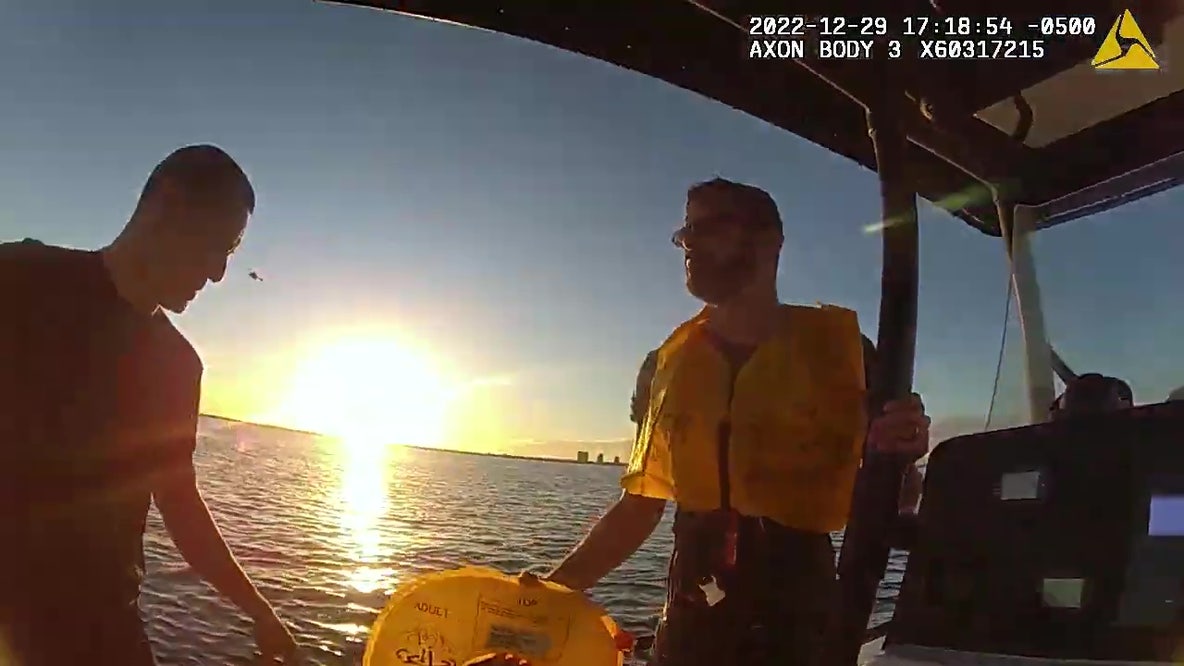 Bodycam video: Watch officers pull man from water after helicopter crash